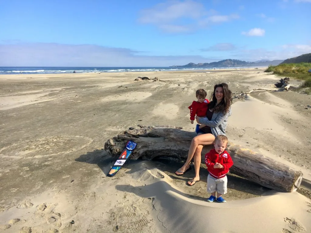 Only One Carry On Travel advice for couples, families, parents with twins, military living over seas. For real people with limited time and money. Toddler twins on pacific coast beach.