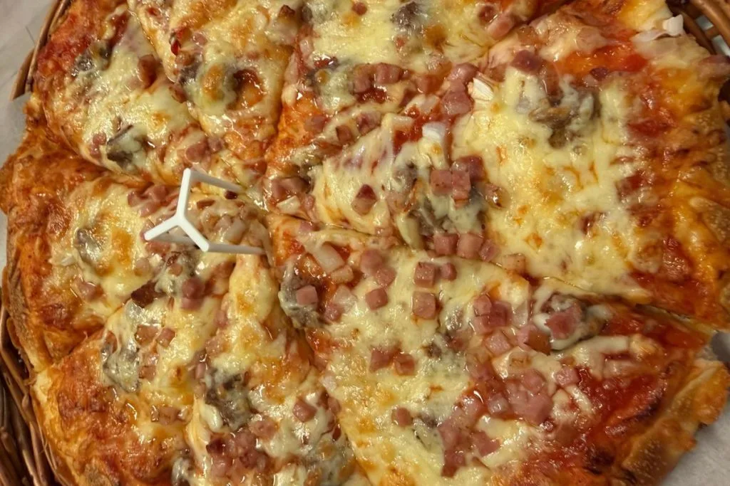 Sliced ham and cheese pizza from Pizzabakeren in Narvik, Norway