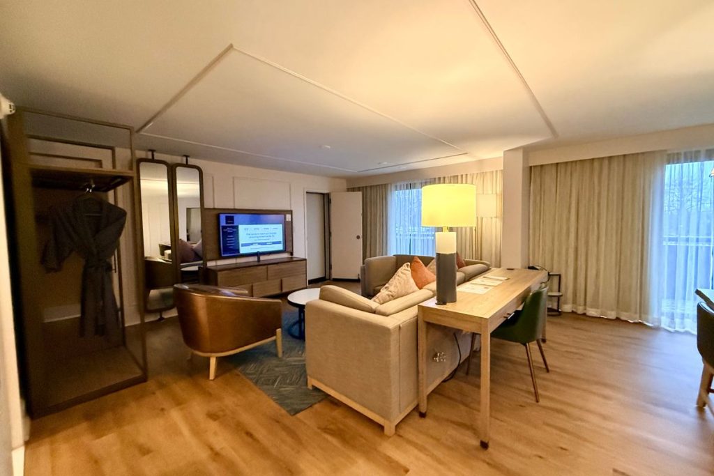 Marriott Griffin Gate Hospitality Suite living room with sectional sofa and balcony doors