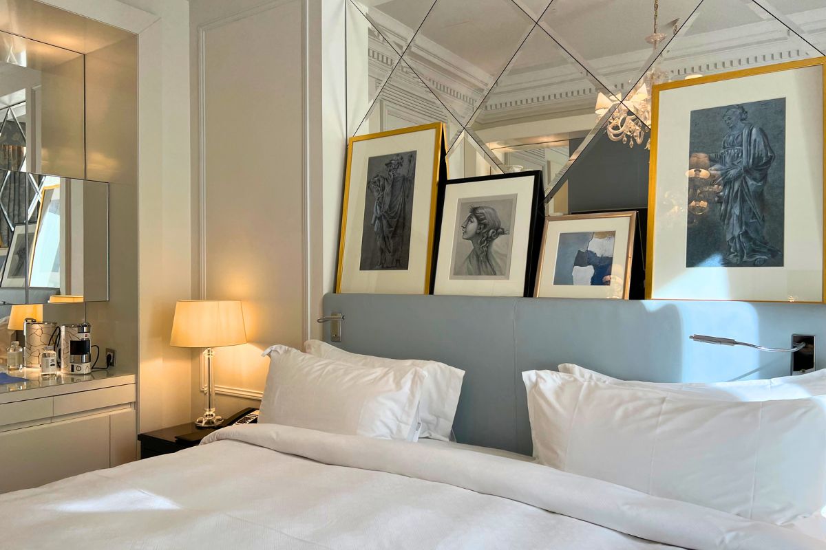 St. Regis Rome Deluxe King room with two luxury beds, desk, TV, and bar area with coffee machine