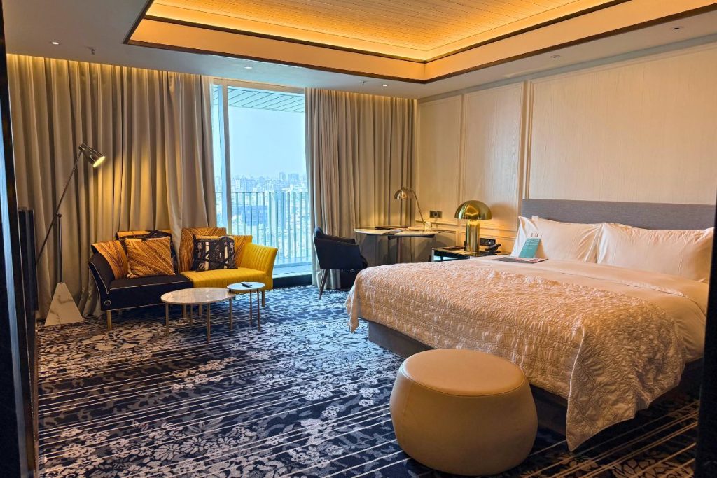 Le Méridien Taichung king room with floor-to-ceiling windows city views and sitting area