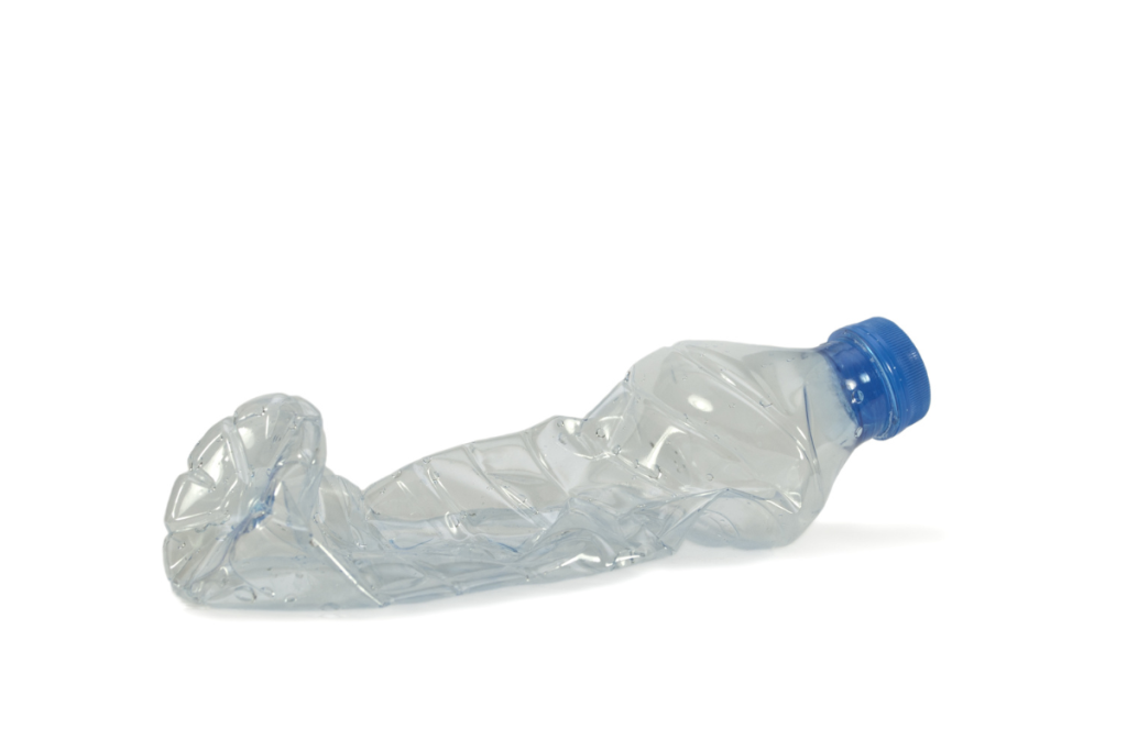 Baby squeezing empty water bottle on airplane — free entertainment for infants on flights