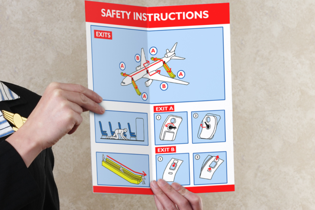 Baby with airplane safety card — free entertainment for infants on planes