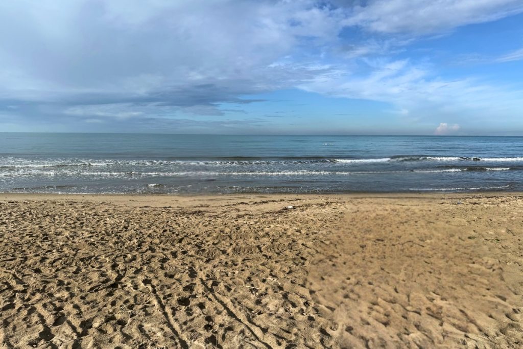 Lalez Bay Albania in December, empty white sand beach at Mövenpick Hotel Lalëz